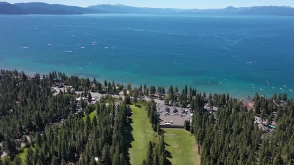 Panoramic View Over Lake Tahoe With Tranquil Water And Lush Vegetation - aerial drone shot