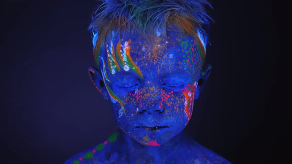 Closeup of a Small Child's Face with an Ultraviolet Pattern on the Face