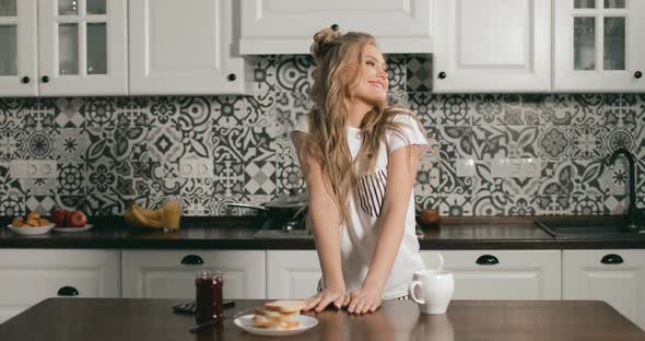 Happy Girl Drinking Coffee in Morning