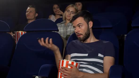 Man Talking on His Phone at the Movie Theatre 1080p