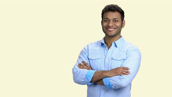 Smiling Indian Businessman Pointing at Copy Space