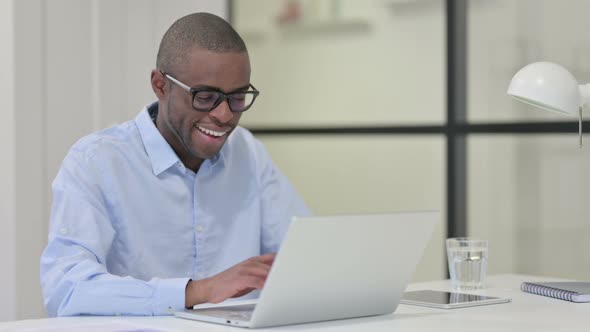 African Man Working Laptop Office