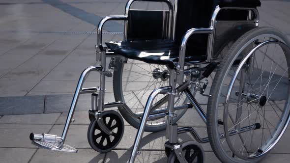 Disables Wheelchair Rolling Near Modern Business District