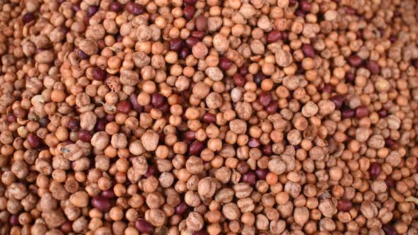 A background texture of a pile of different types of colorful nuts