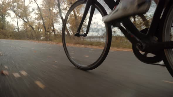 Sport Athlete Cyclist Twists Pedal Rotate Wheel On Road Bike. Cycling Triathlon Intensive Training.