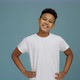 Portrait of cheerful little boy with curly hair in T-shirt smiling funny and posing to the camera - VideoHive Item for Sale