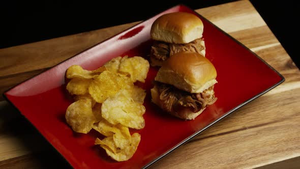 Rotating shot of delicious pulled pork sliders - BBQ 