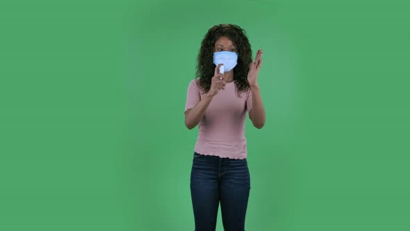 Portrait of Beautiful African American Young Woman in Medical Protective Face Mask Looking at Camera