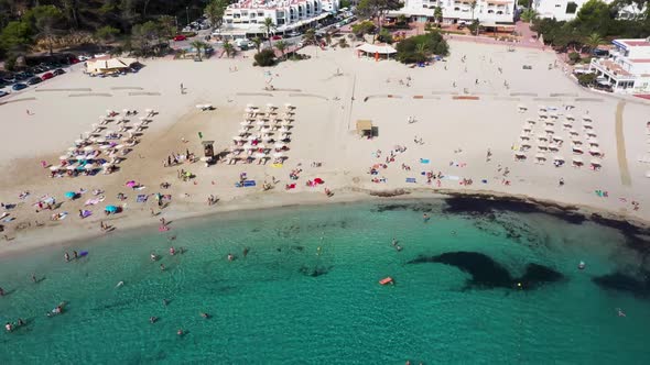 Aerial footage of the Spanish island of Ibiza showing the beautiful beach front and hotels