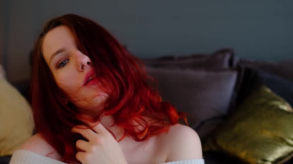 Serene Attractive Young Woman Resting on Couch in Her Room