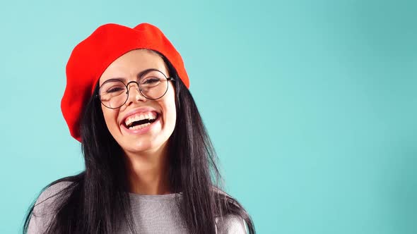 Glamorous Portrait of a Smiling Beautiful Woman in a Red Beret