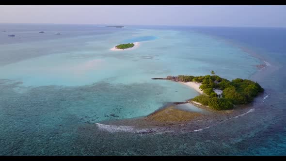 Aerial top view panorama of relaxing lagoon beach holiday by blue sea and white sand background of j