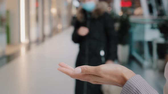 Closeup Female Hands Unrecognizable Woman Wipes Arms with Antiseptic in Public Place Handles Palms