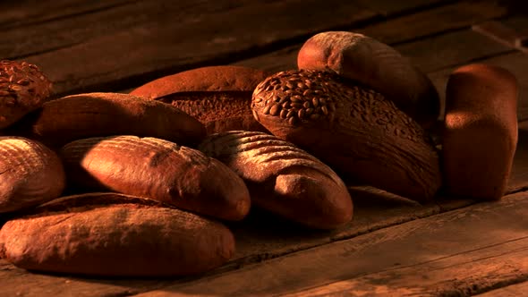 Freshly Baked Bread on Wooden Background