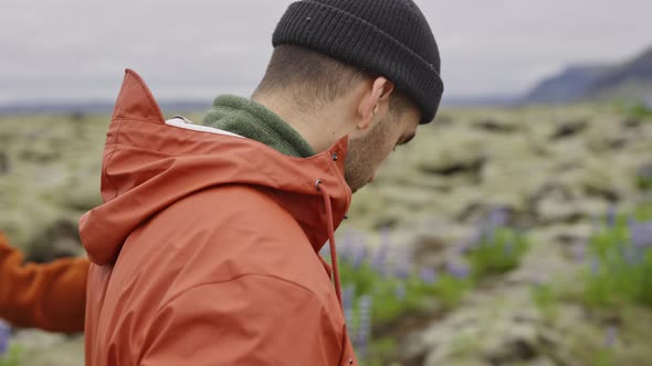 Young Couple Hiking in Moss Covered Landscape