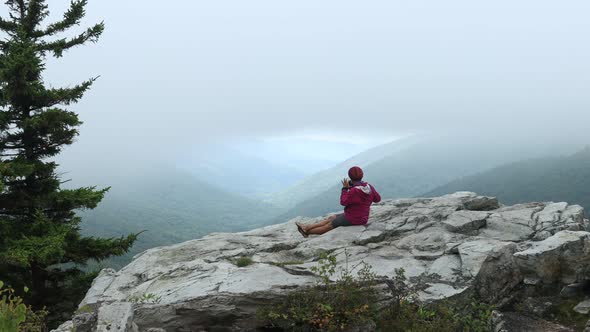 A woman sits at the Rohrbaugh Cliffs in the Dolly Sods Wilderness, part of the Monongahela National