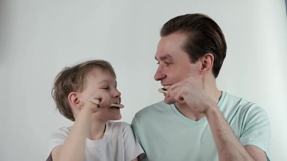 Father and Son Teeth Brushing