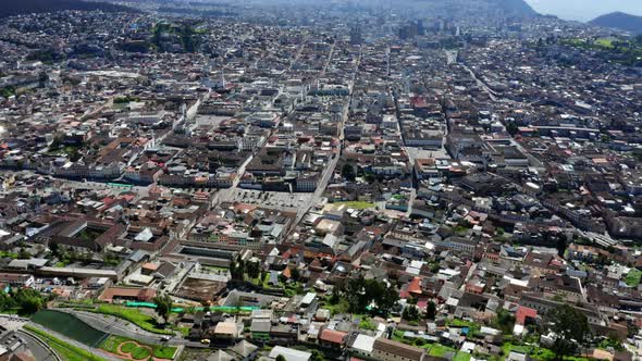 Cityscape background, aerial view over Quito, a large city