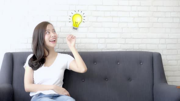 Asian woman thinking with drawing question mark for decision and have a idea and pointing light bulb