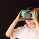 Blonde boy looks with virtual reality glasses and watching VR 360 video again - VideoHive Item for Sale