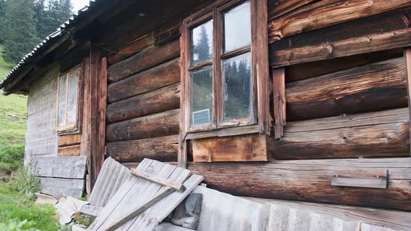 Tradition Old Wooden House on Hill in the Carpathian Mountains Near Green Valley