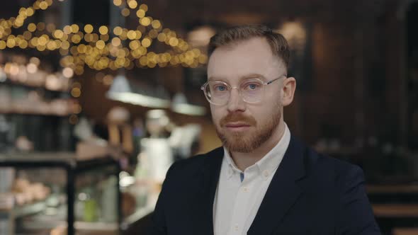 Adult Bearded Male Entrepreneur Looking at the Camera with Serious Face