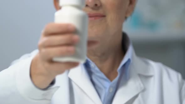 Doctor Showing Bottle With Medicine to Camera, Pills Prescription, Closeup