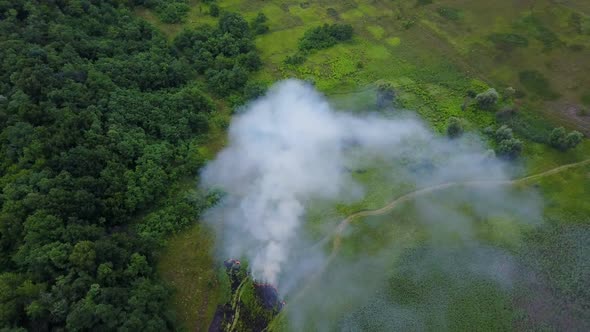 Aerial Footage From Drone of Burning Green Field, Wild Fire in Nature Landscape, Flight Through a