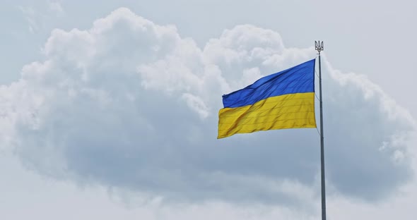 Slow Motion Blue Yellow Ukraine Flag Wind Waving on Cloudy Sky Background
