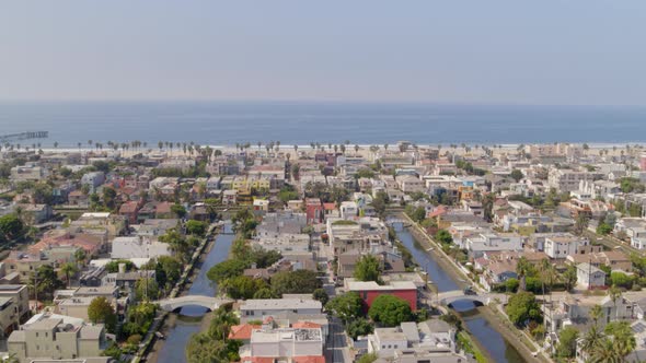 Aerial of residential blocks and calm sea in city