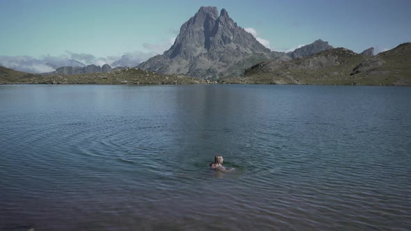 View of a Young Lady Getting Out of the Lake Ayous After Taking Bath in the Pristine Blue Lake on a