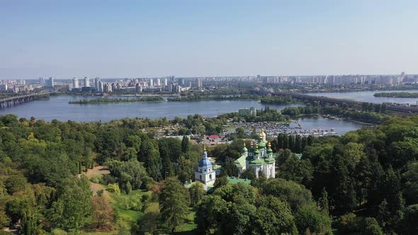 Capital of Ukraine - Kyiv city. Top view of cityscape, blue Dnipro.