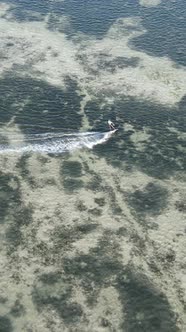 Vertical Video Kitesurfing Near the Shore of Zanzibar Tanzania