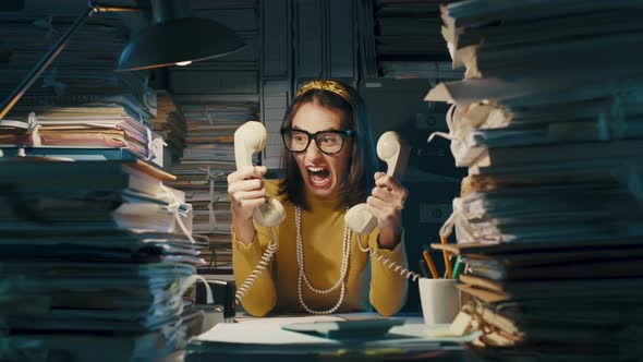 Nervous office worker shouting at customers on the phone