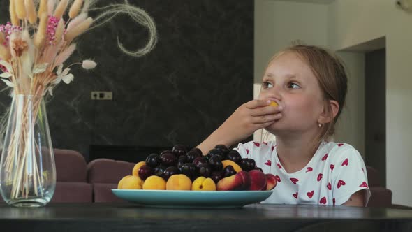 Little Girl Eats and Laughs