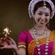 Asian female in traditional dress holds sparkle, 4k super slow motion studio shot - VideoHive Item for Sale