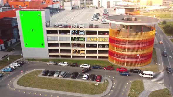 Billboard for advertising on the facade of a multi-level parking lot near a shopping center