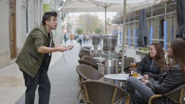 Magician Man Showing Street Magic Trick