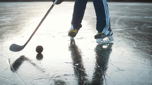 Ice Hockey Player Point of View Shot of a Puck Being Shot on Frozen Lake Professional Player