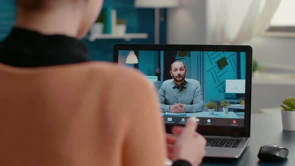 Young Woman Meeting with Business Man on Video Call