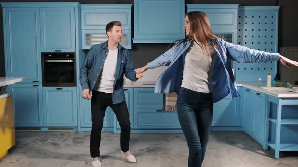 Happy Family Dance, Young Couple Fun Dancing While Cooking in the Kitchen at Home, Making Dance