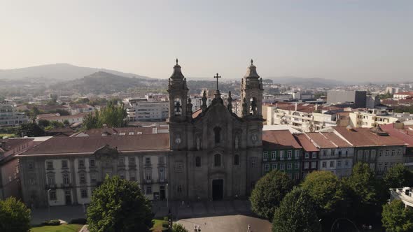 Aerial rotation over Old Congregados Minster Building, Braga old town - Portugal