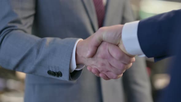 Close Up Shot of Two Businessmen Shaking Hands