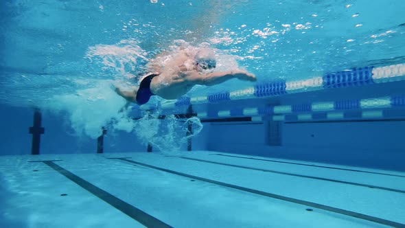 Swimmer Uses Breaststroke Technique Underwater