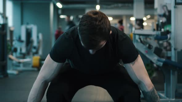 Young Sportsman Lifting Heavy Barbell.