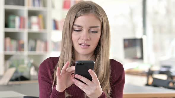 Portrait of Attractive Young Woman Using Smartphone