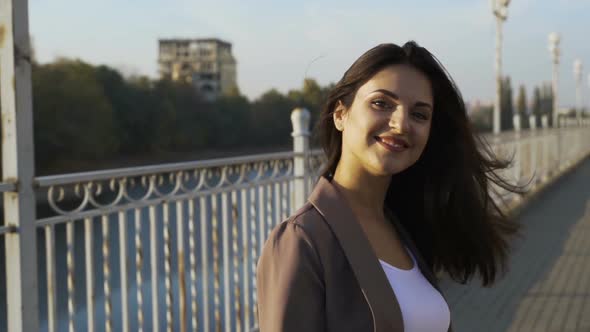 Beautiful Brunette Businesswoman In Business Clothes Walks In The City