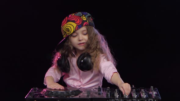 Little Girl Dj in Bright Cap Playing on Vinyl. Studio