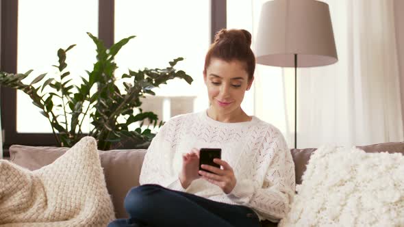 Woman with Smartphone at Home 