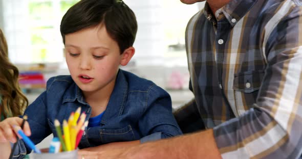 Parents helping childrens with school homework